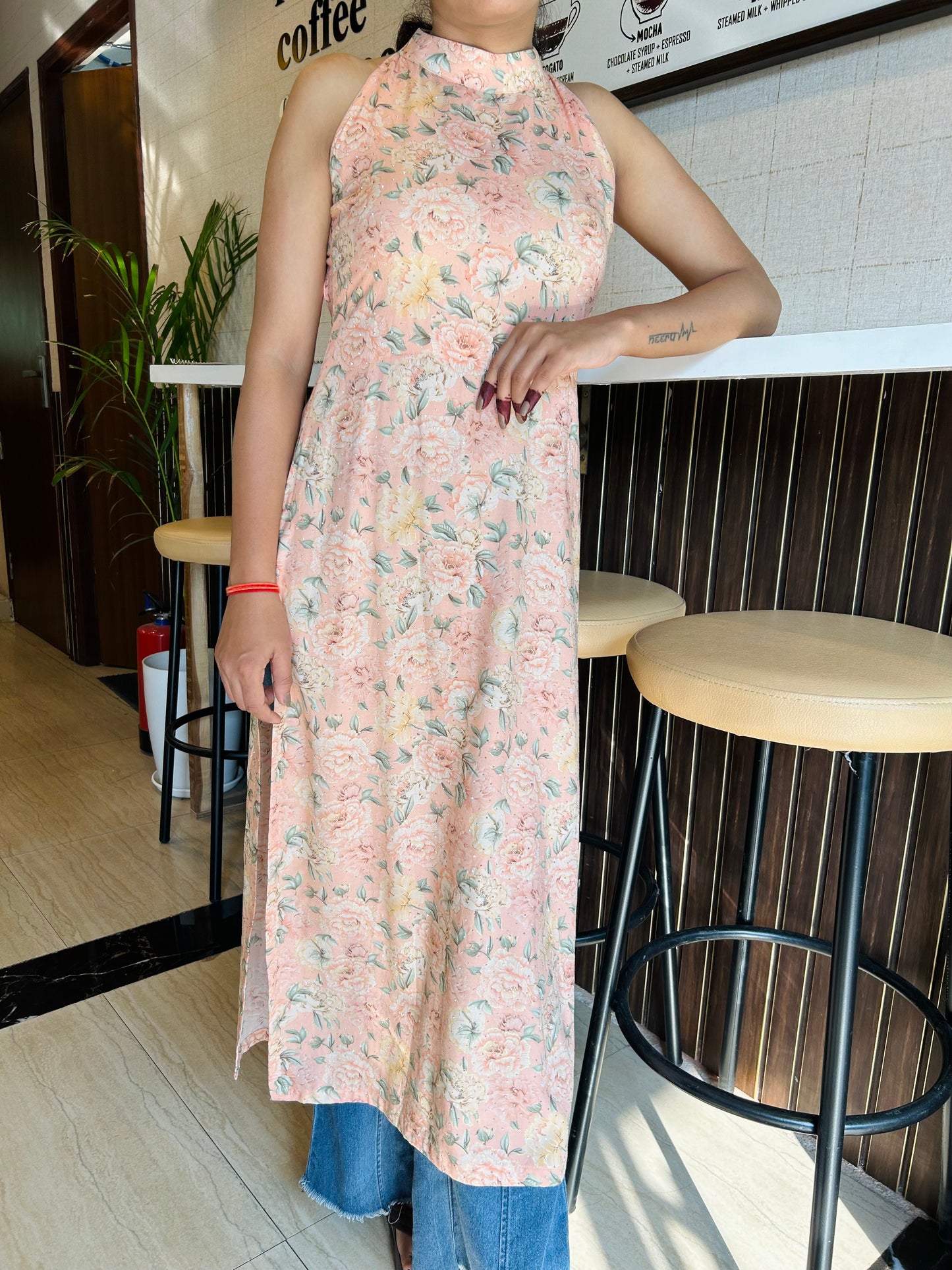 Floral pink halter-neck kurti, sustainable fashion kurti, floral A-line kurti, casual wear kurtis, eco-friendly kurtis, women’s floral kurti, stylish pink kurti, halter-neck kurti with open-back