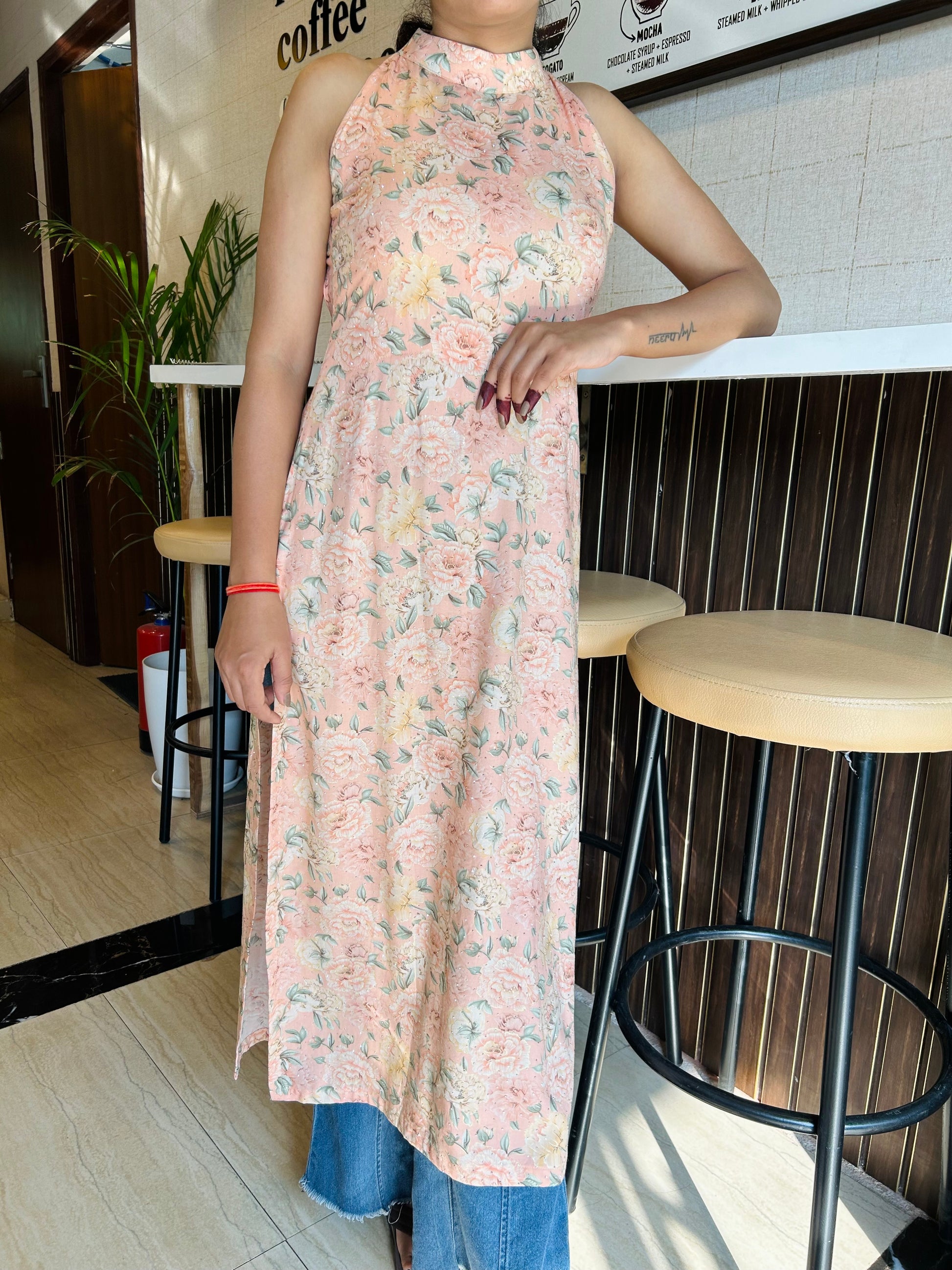 Floral pink halter-neck kurti, sustainable fashion kurti, floral A-line kurti, casual wear kurtis, eco-friendly kurtis, women’s floral kurti, stylish pink kurti, halter-neck kurti with open-back